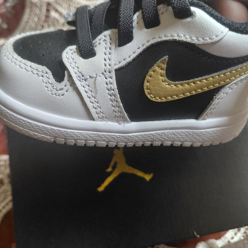 Kids Black and Gold Nike Shoes
